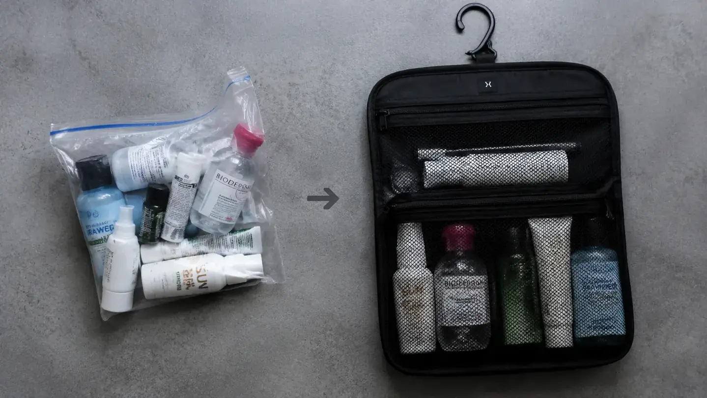 Flat lay showing TSA quart bag filled with travel-size bottles beside a full-size toiletry bag for size comparison